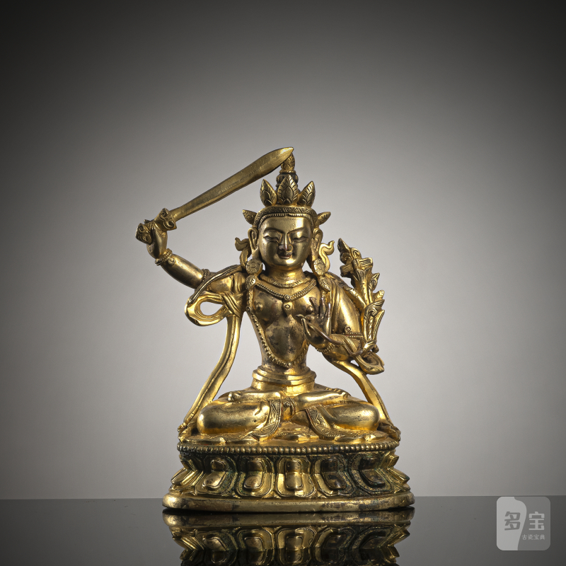 A GILT-BRONZE FIGURE OF MANJUSHRI